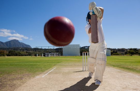 Batsman striking a cricket ball