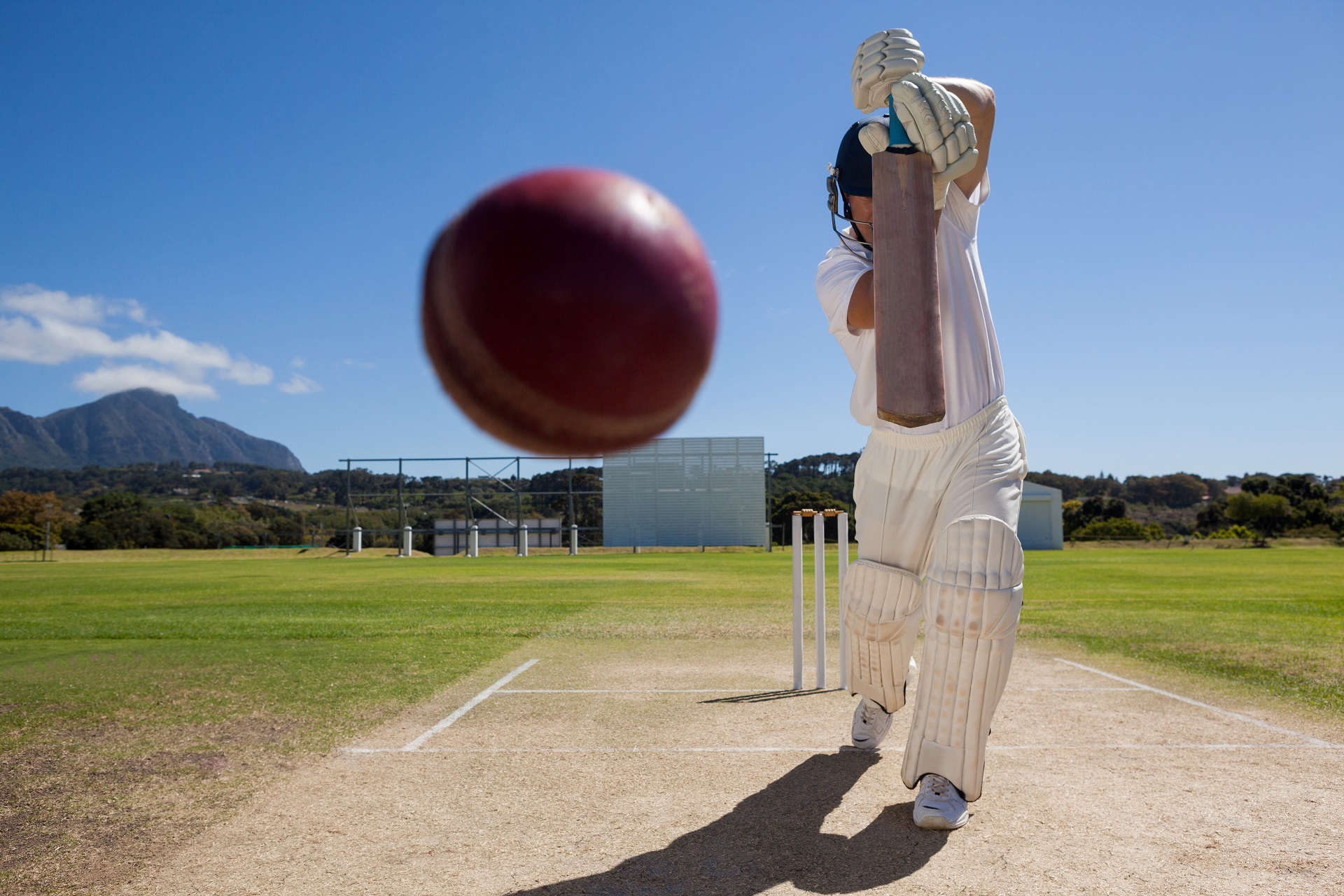 Cricket player batting on a pitch during a match, representing organised sports activity supported by Temple Legal Protection’s legal expenses insurance for sports and fitness clubs